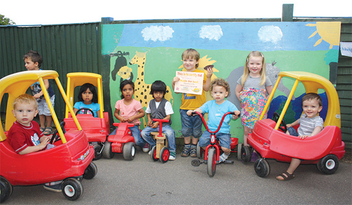 Three year-old Finn Henderson, winner of the 'Under Fives Cup Cakes' (centre) with some of his friends at Tots Village Nursery.