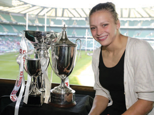 Kay Wilson pictured at Twickenham Stadium on the occasion of the British Universities and Colleges Women's Rugby Final with some of the silverware she had a part in winning: The British Universities and Colleges (BUCS) Final won by her team, University of Wales in Cardiff (UWIC); The RBS Six Nations Cup won by England for a record seven times in a row (and a third successive Grand-Slam); The IRB Womens Challenge Cup won by England at the Hong Kong Seven-aside Tournament.